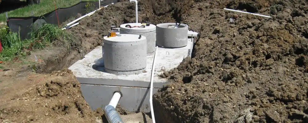 Septic system repair and installation site with tank access ports in Sacramento, CA